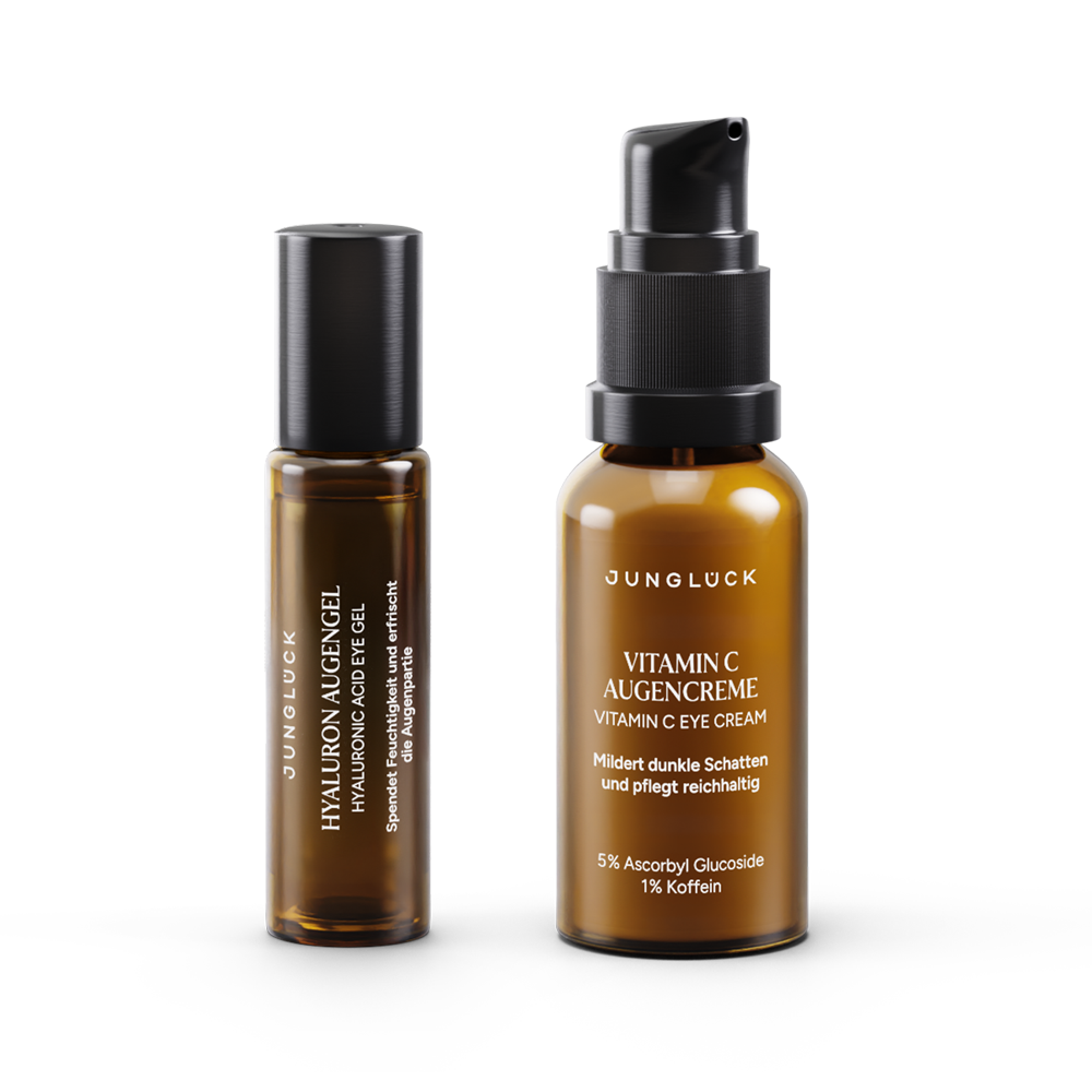 Two amber glass bottles side by side; one slim roller bottle with black cap, one wider pump bottle labeled Vitamin C.