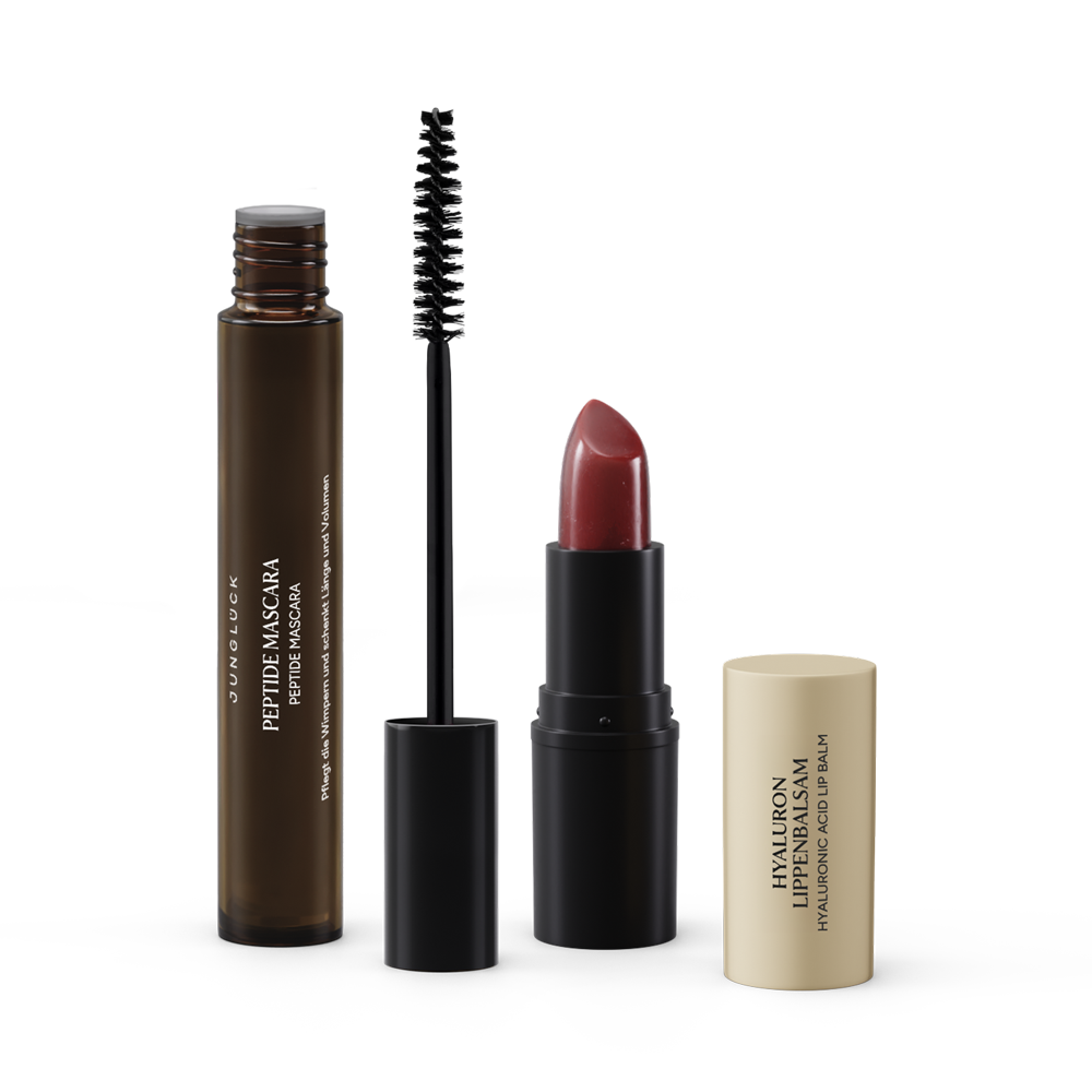 Beauty Essentials Rosenholz Set mit Peptide Maske, Mascara und Lippenstift in warmen Farbtönen.