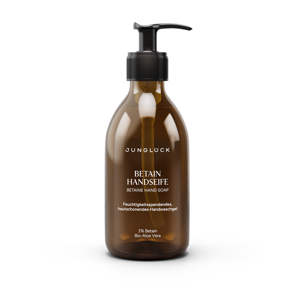 Amber pump bottle of Jungluck Betain hand soap with white and orange text.