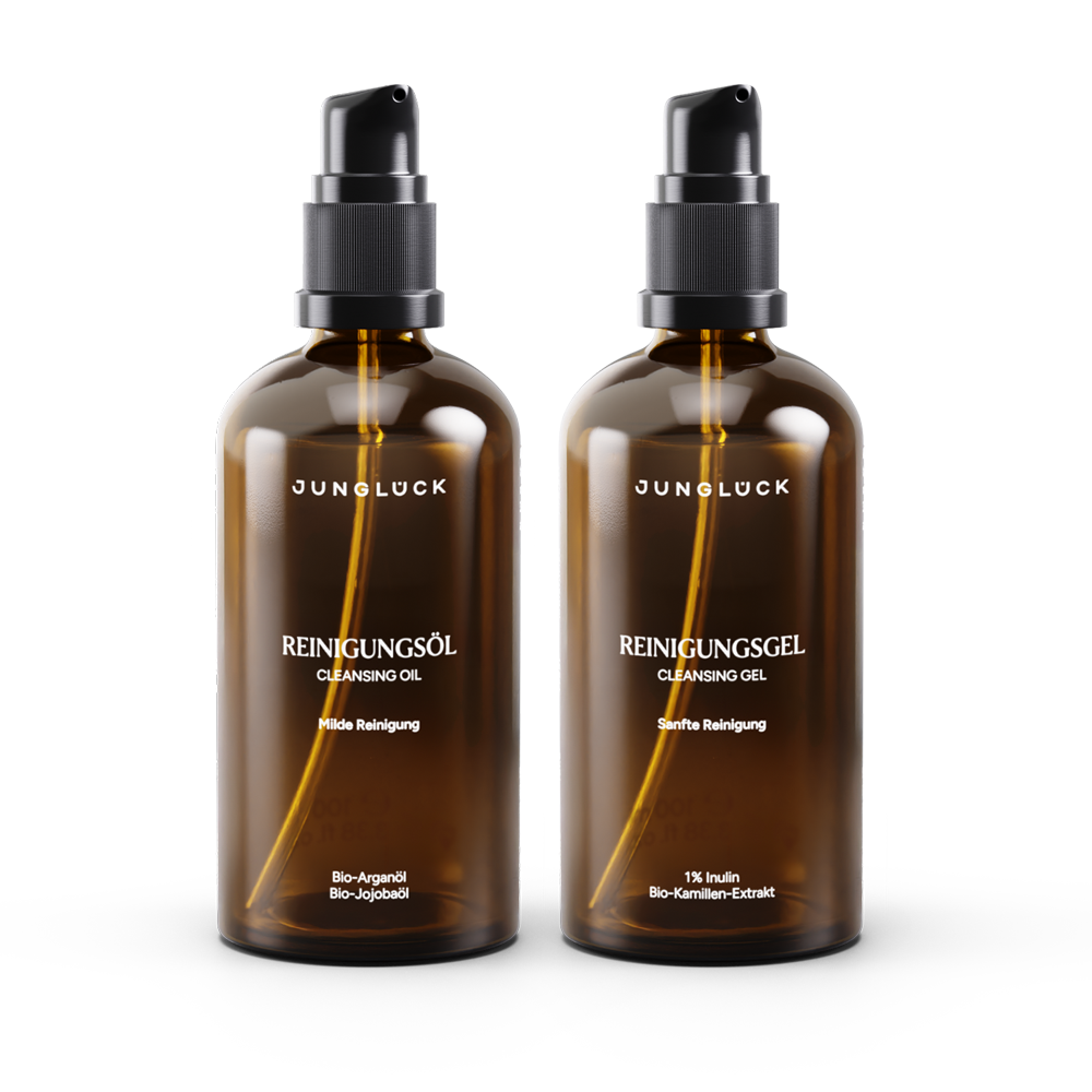 Two amber glass bottles with black pump caps labeled Reinigungsöl and Reinigungsgel by Junglock.