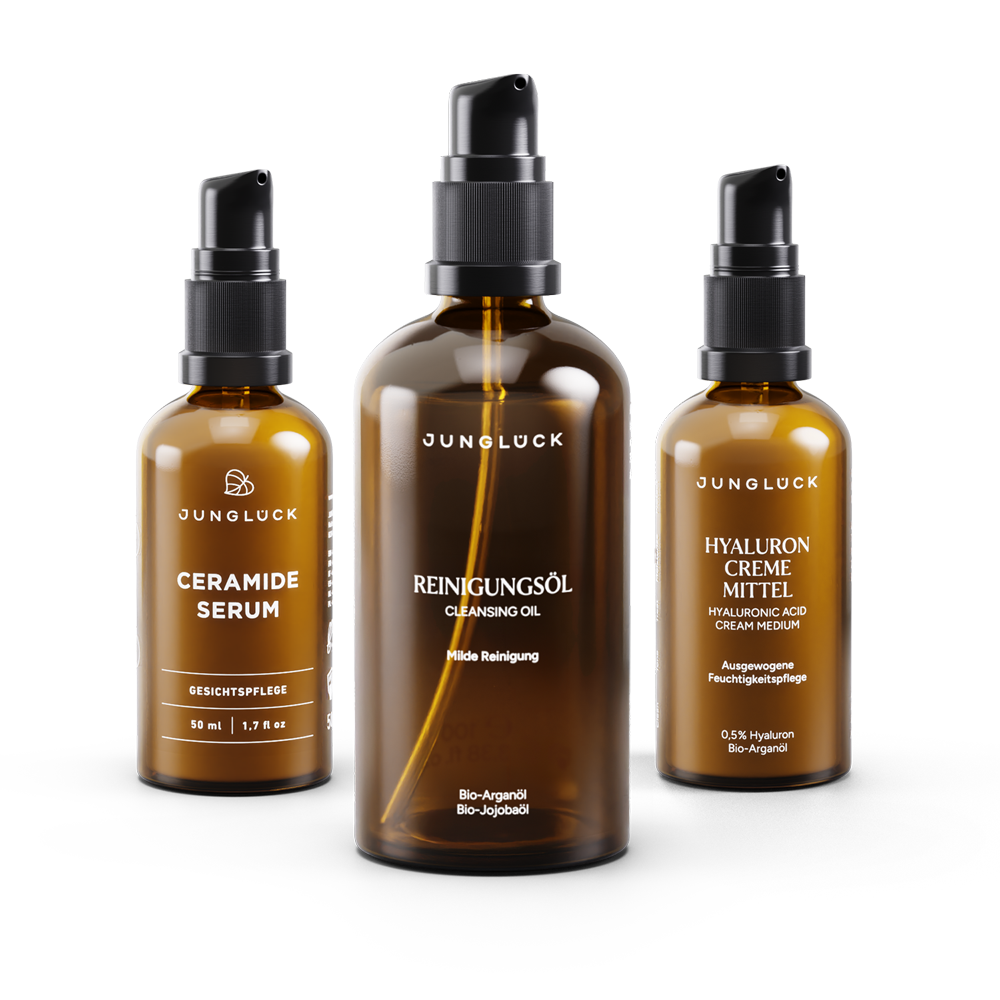 Set zur Hautbarrierestärkung mit drei Braunglasflaschen: Reinigungsöl, Hyaluron Creme Mittel und Ceramid Serum.