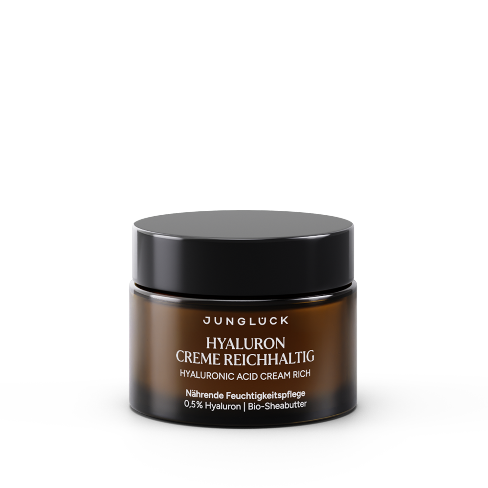 Brown glass jar of Junglück Hyaluron Creme Reichhaltig with black lid and white text, 50 ml size.