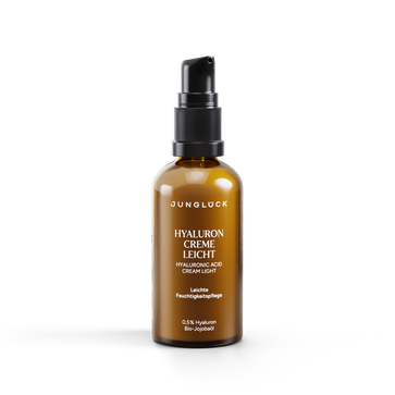 Amber glass pump bottle of Jungluck Hyaluron Creme Leicht with white and black label, 50 ml size.
