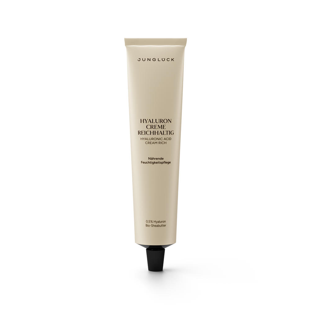 Beige tube of Jungluck Hyaluron Creme Reichhaltig with black cap and black text on front.
