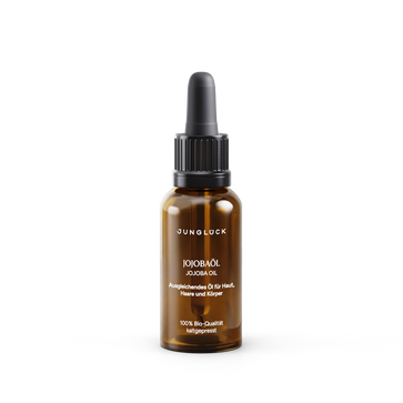 Amber glass dropper bottle of Junglock Jojobaöl with black cap and white text, 20 ml size.