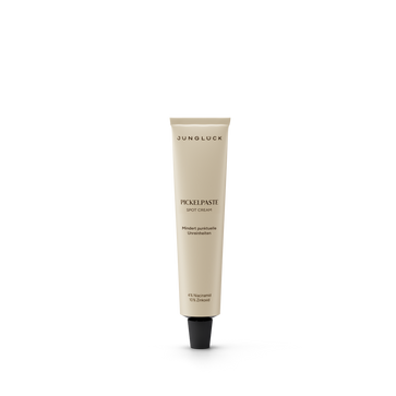 Beige tube of Pickelpaste facial care cream with black cap and minimal text design.