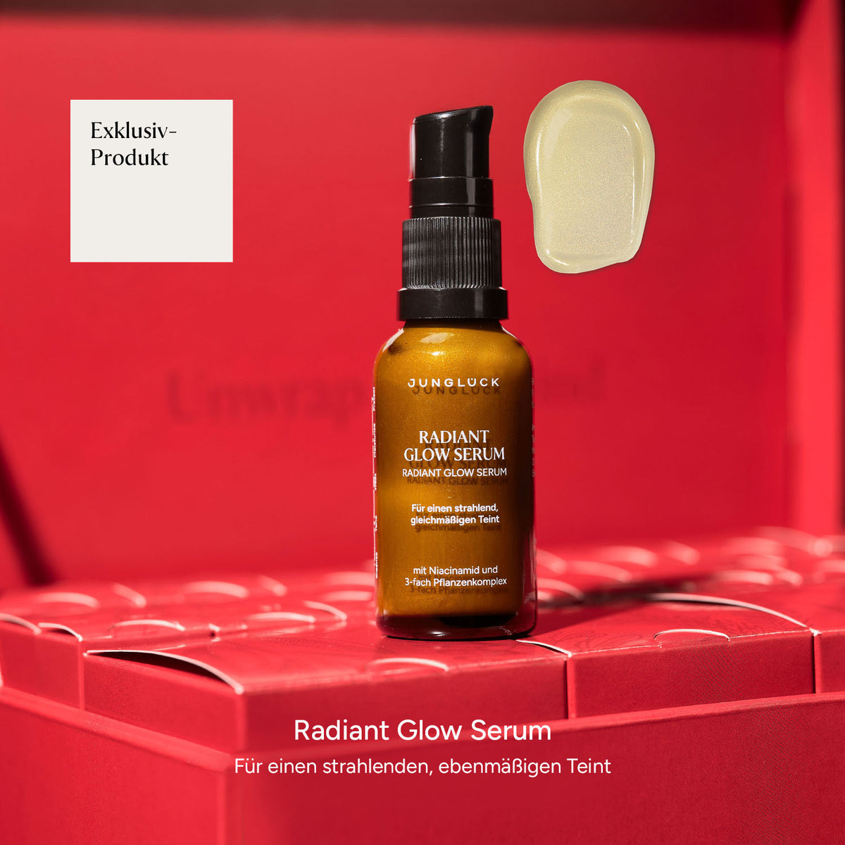 Radiant Glow Serum in Braunglasflasche auf rotem Hintergrund. Enthält Hinweise auf einen strahlenden Teint.
