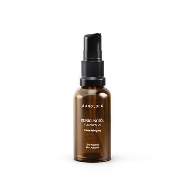 20ml amber glass bottle with black pump cap labeled Reinigungsöl cleansing oil.