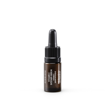 5 ml dark amber glass dropper bottle of Vitamin C Intensiv Serum with black cap and white text label.