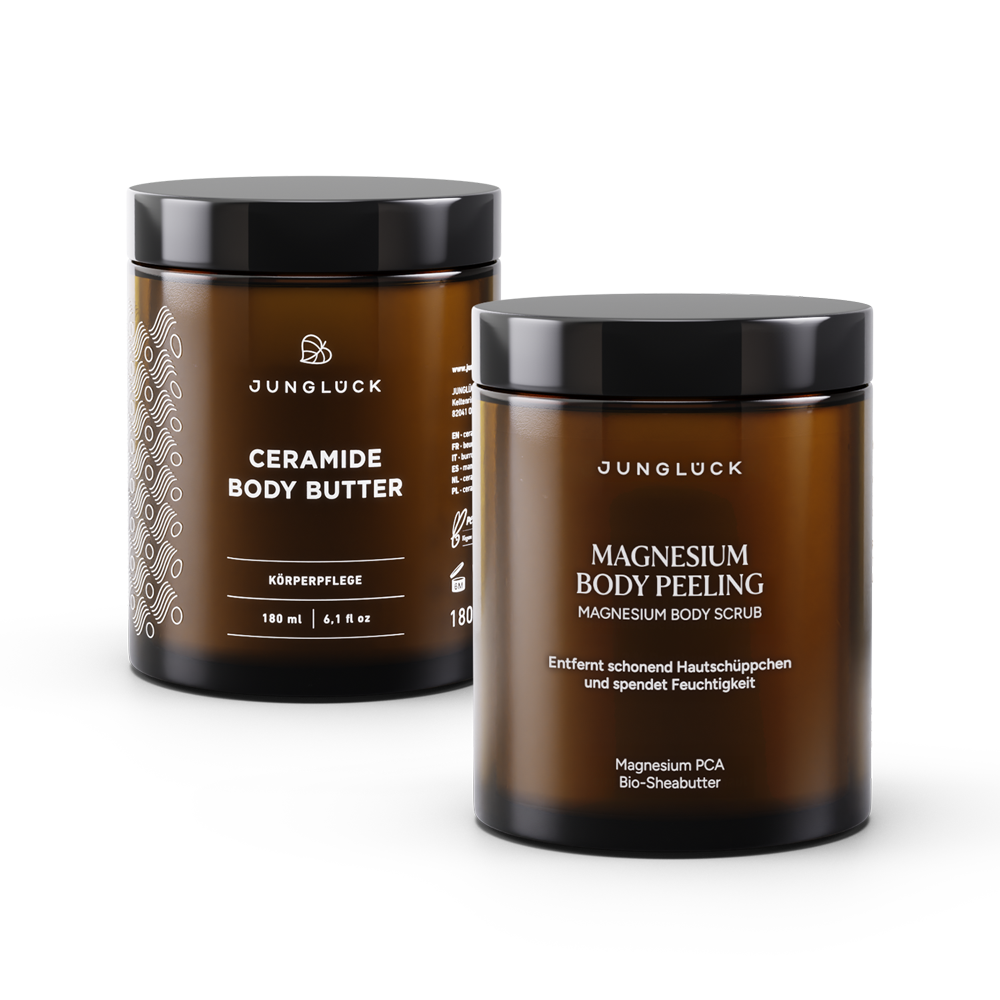 Brown glass jars with black lids featuring Jungluck Ceramide Body Butter and Magnesium Body Peeling labels.