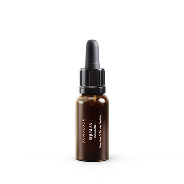 10ml amber glass dropper bottle of Squalan oil-free facial serum with black cap.