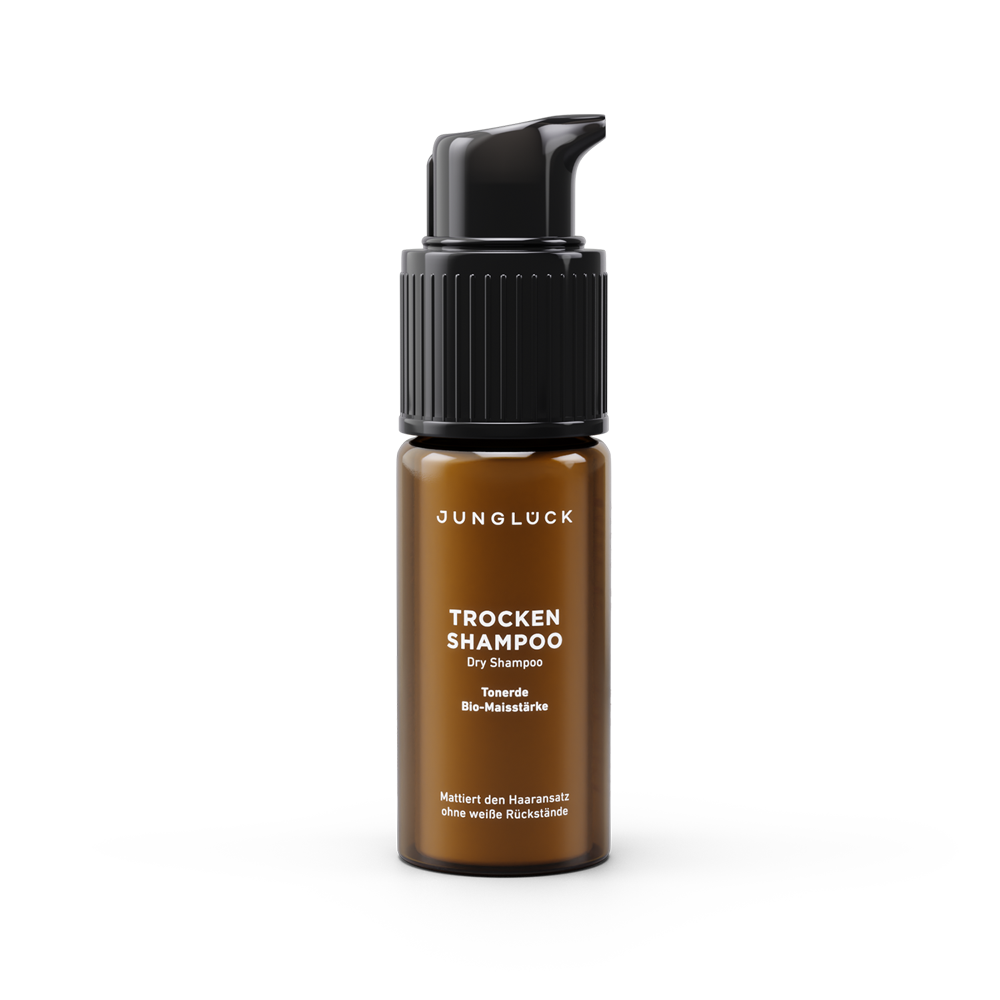Small amber pump bottle of alcohol-free dry shampoo for light hair, fragrance-free formula.